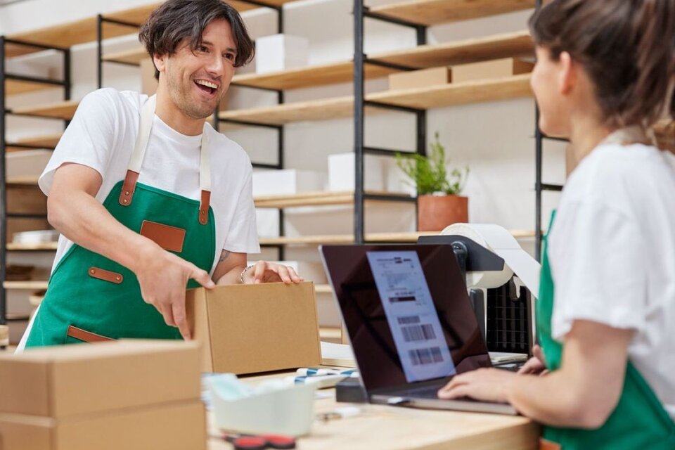 man and woman preparing shipments