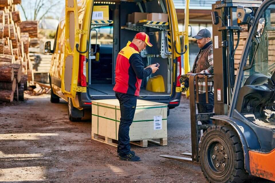 DHL driver delivering a pallet