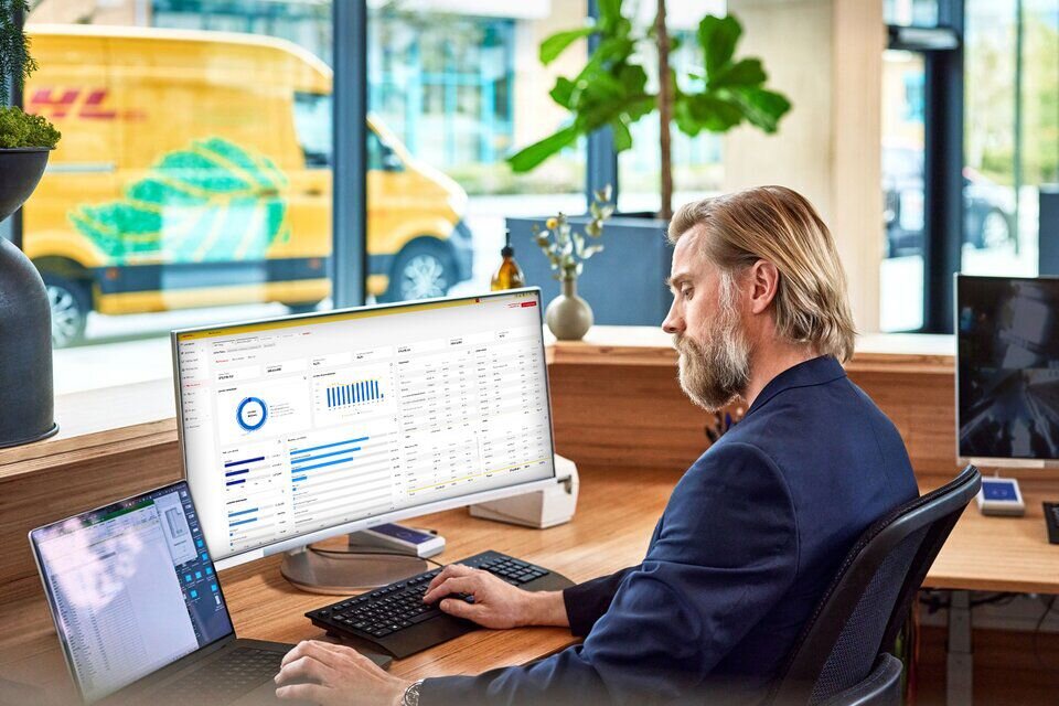 man checking reports in My DHL Portal