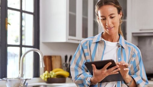 woman checking track and trace on tablet