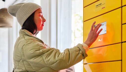 woman returning parcel via parcel locker
