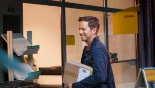 man entering DHL ServicePoint