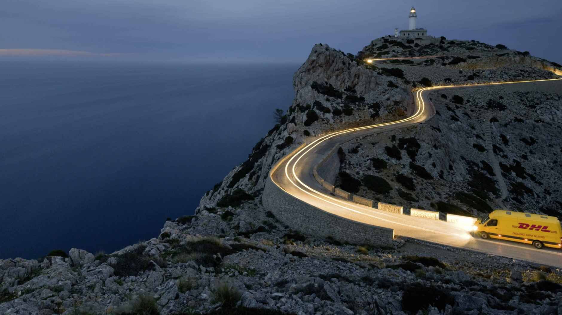 DHL van driving on island at night