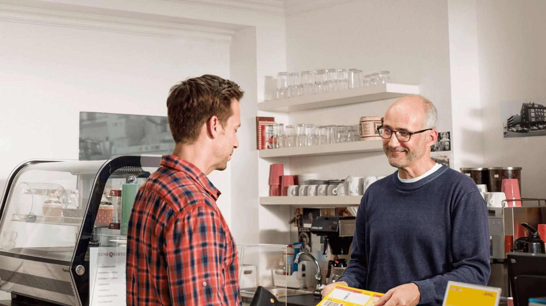 man collecting parcel at a servicepoint