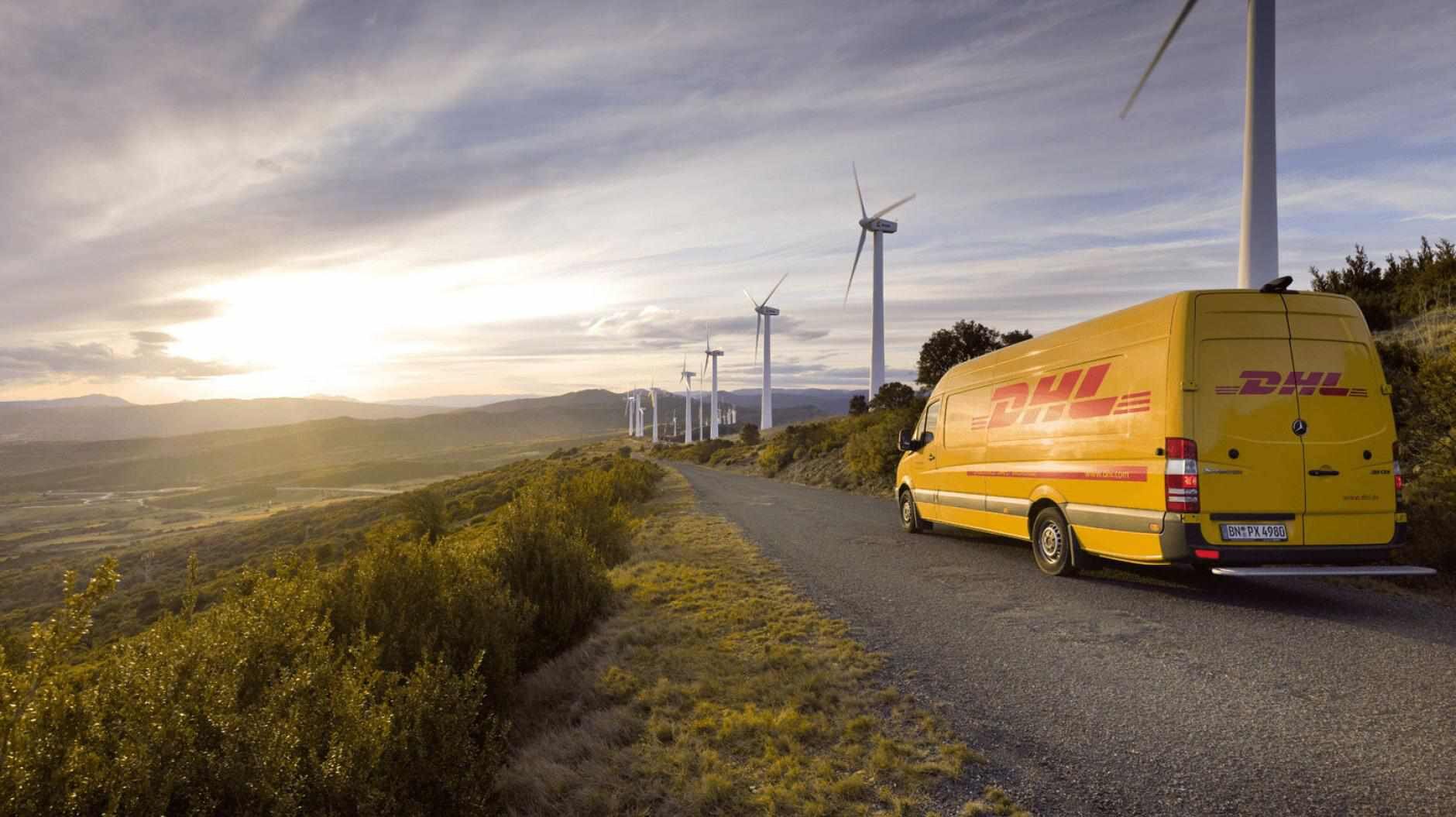 DHL van driving next to windmills