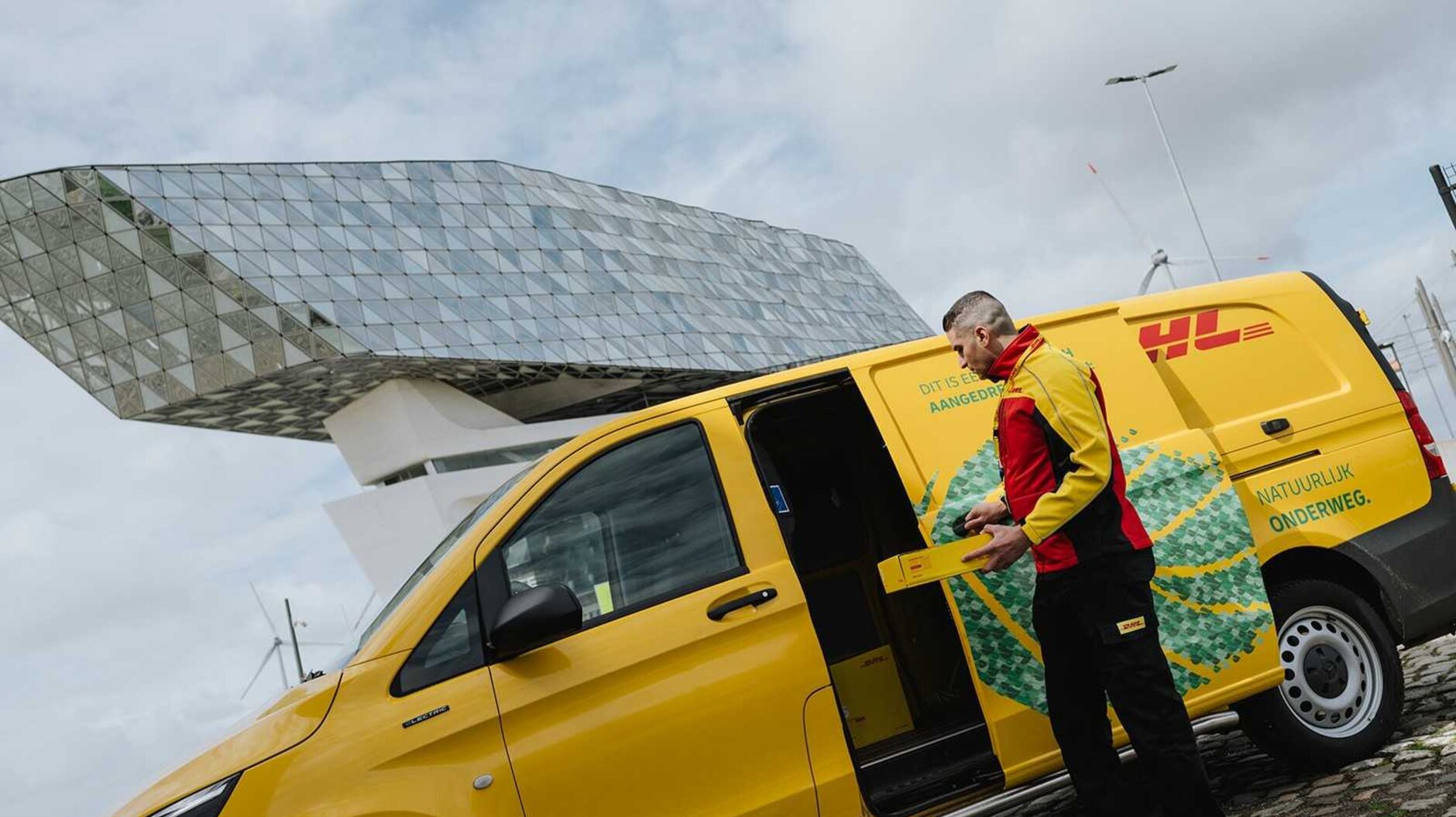 DHL courier with electric van in Antwerp