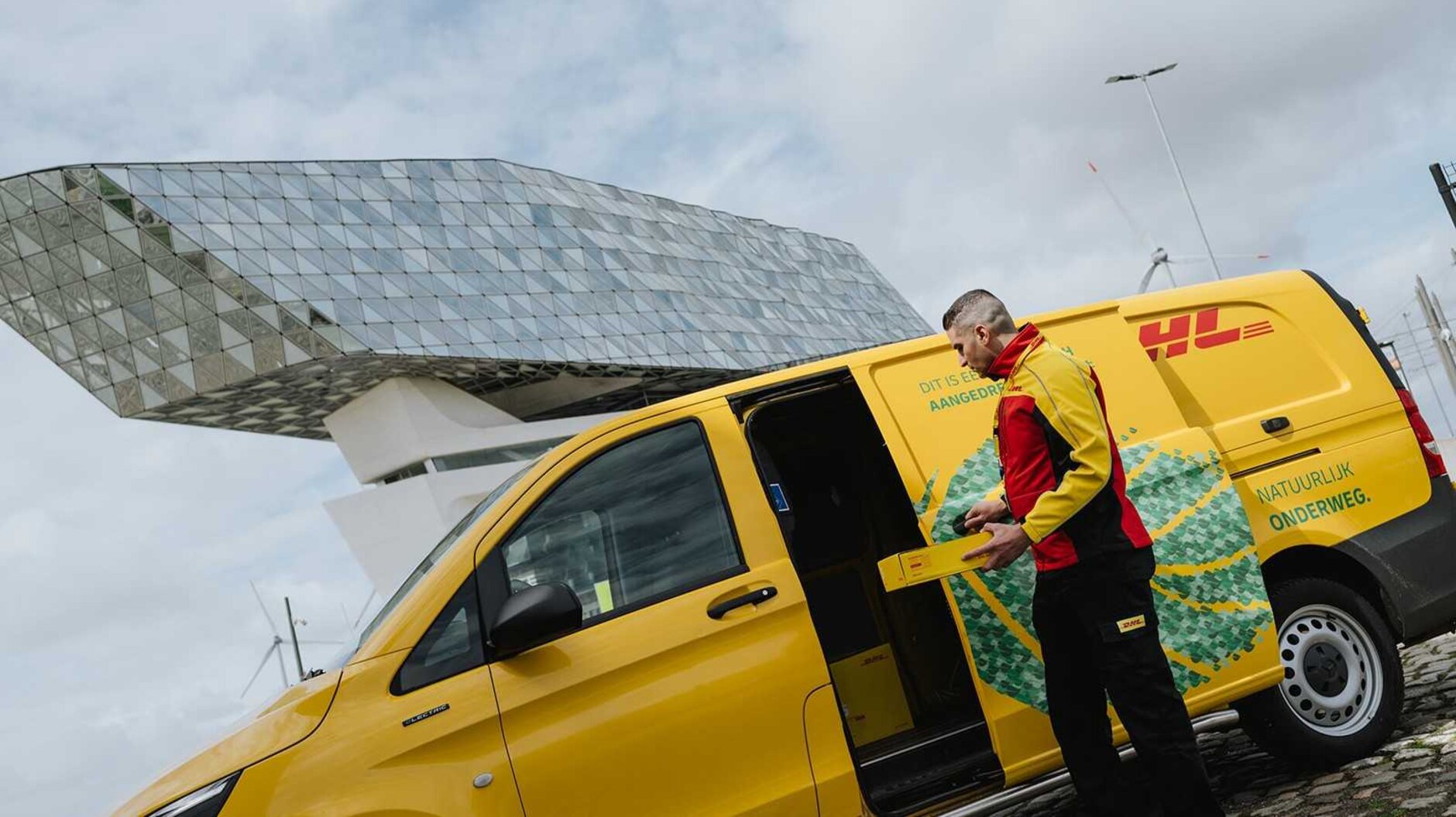 DHL courier with electric van in Antwerp