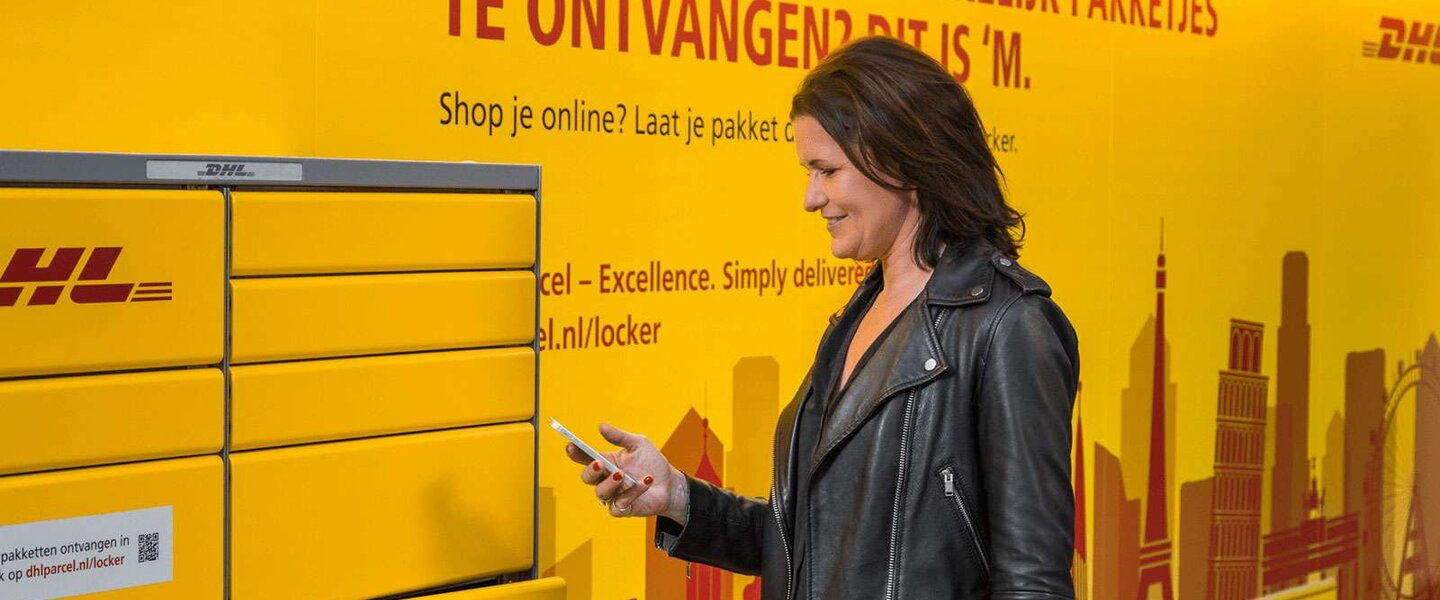 woman collecting parcel at locker