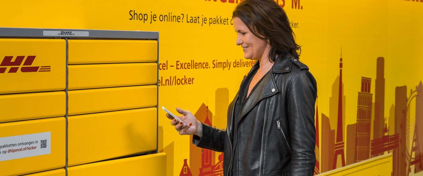 woman collecting parcel at locker