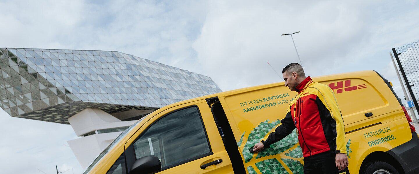 DHL courier driving an electric van