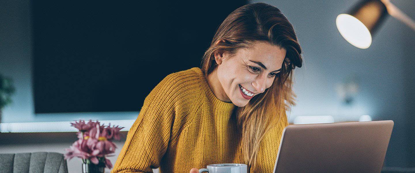 woman looking at her computer screen