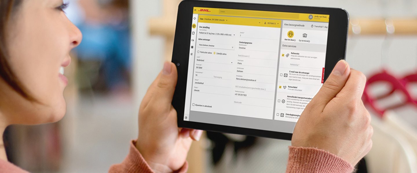 woman checking My DHL Portal on tablet