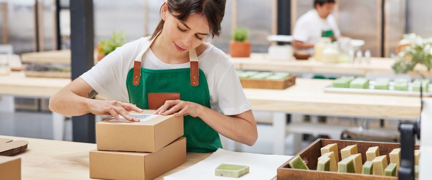 woman packing goods for shipping